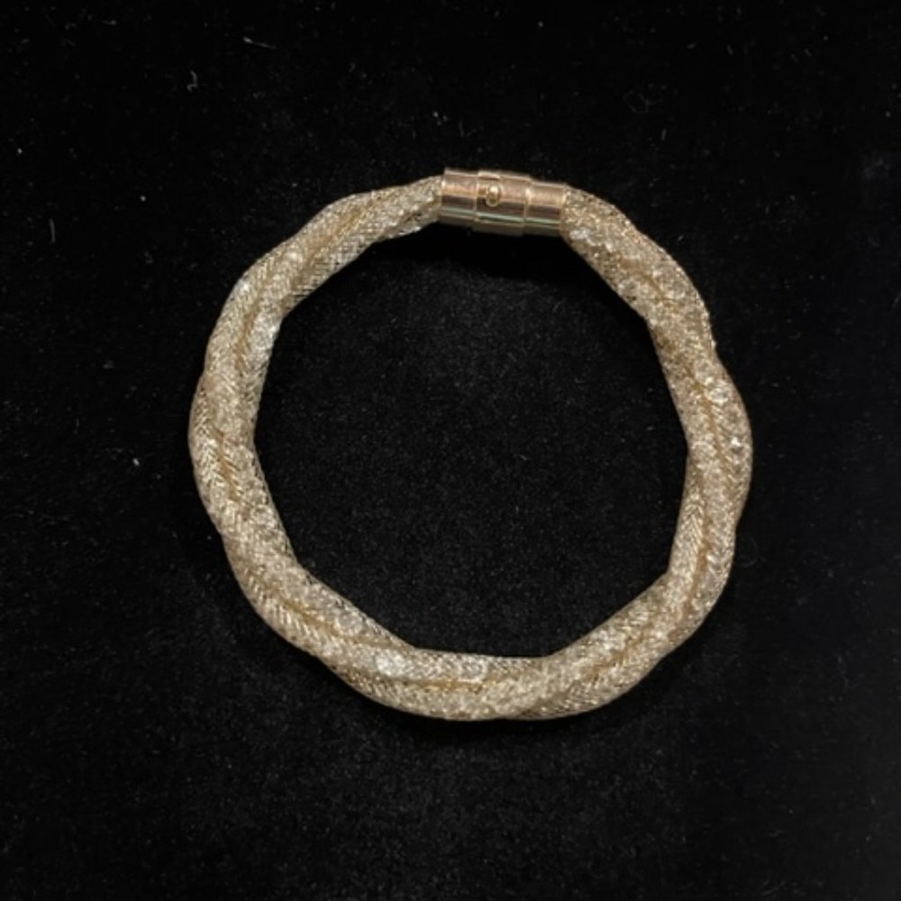 Gold tone metal mesh crystal lined bracelet